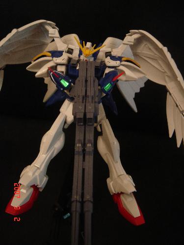 Wing-Gundam Zero Custom - Wing Gundam spreading its wings and getting ready to blast from his blaster gun. . . ready ready~!!