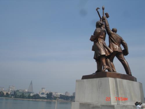 Juche Tower figuresq - These are figures below the Juche tower representing the three important sectors of society: the farmer, the worker and the academic.