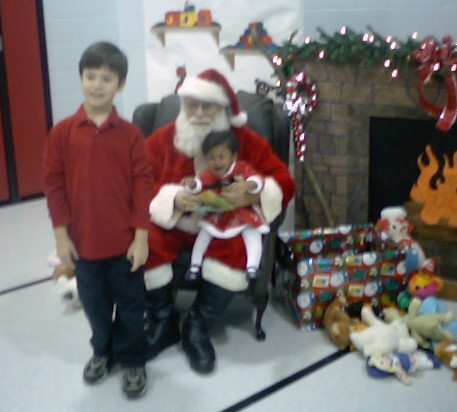 Sacred of Santa - Here is my 10 month old and 7 year old with Santa. The baby was scared out of her mind.