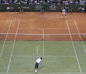 Federer Vs. Nadal - A picture of Roger Federer against Rafael Nadal on a dual surface court