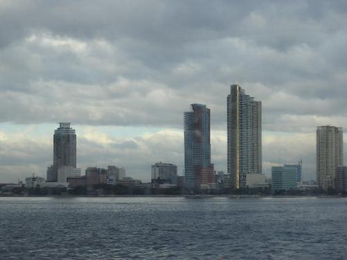 Manila City view from Manila Bay - Manila's shoreline. Buildings along Roxas Boulevard. photo taken while on a ship in Manila Bay