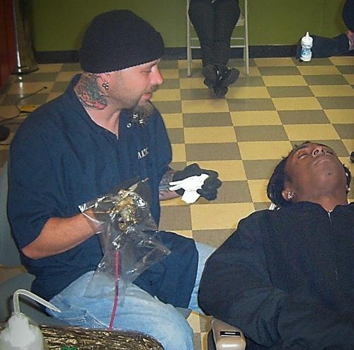 tattooing Lil Waynes eyelids - Wayne and myself right before the tattoo began