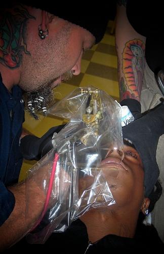 tattooing lil waynes eyelids  - tattooing 'Fear God' on lil waynes eyelids