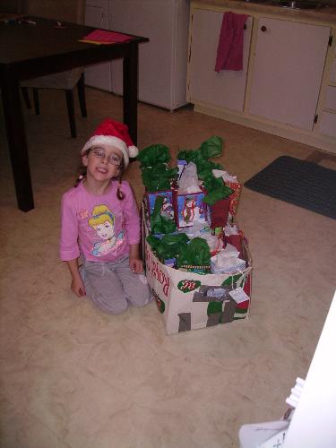 my daughter - my daughter packing up the presents to take to the nursing home