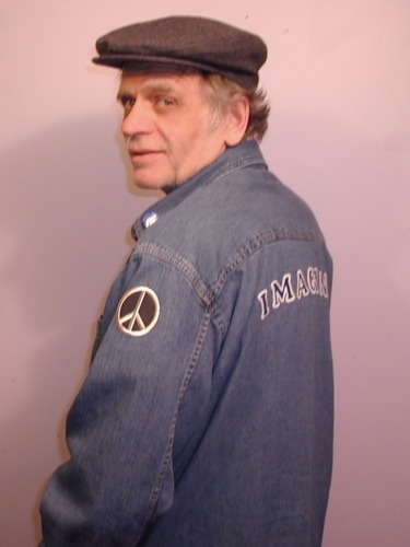 My husband John~ on our way to the John Lennon Ima - My husband is almost as big a fan of John Lennon as I am; one year he dressed up as John for Hallowe'en. (He supplied the hat... I attached the IMAGINE letters to the back of his shirt) But the day this picture was taken we were on our way to Strawberry Fields in Central Park, NYC to visit the Imagine Memorial. It was a bittersweet experience.