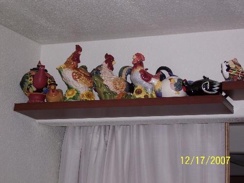 My rooster teapot grouping - My shelf with my rootsers.