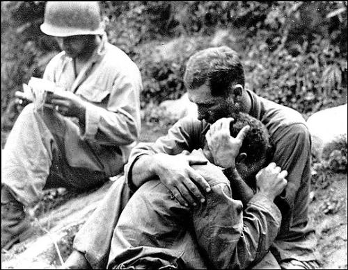Al Chang - This is a picture taken during Pearl Harbor in which a man breaks down in a friends' arms upon learning of a friends' death...  this picture breaks my heart