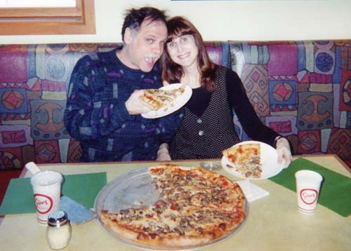 A man a woman and a pizza - My husband John and me about 5 years ago.