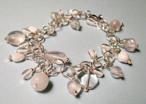 'Ice & Snow' Bracelet - This bracelet is made ith an assortment of clear and milkey-white glass beads in assortment shapes and sizes. It reminds me of Ice & Snow... and the great thing is-- it goes with everything! Measures 8' in length and made with sterling plated rings. At my shop at Etsy.com. For the link, go to my profile page.