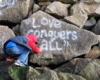 Love conquers all - a hand written love on the rocks