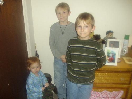 here's the last one i promise - again my three children all around daddy's area.