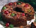 fruitcake - This Fruitcake looks very tasty and very pretty. I always like the looks of a Fruitcake, but usually don't think they are very tasty at all. I have heard that Fruicakes are made and saved for a year and then eaten, it's supposed to bring some kind of good luck to your harvest for the folling year. There are many recipes for Fruitcake, but I have never been brave enough to try to make one.