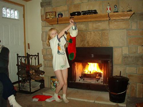 My daughter taking her stocking down to empty.  - I love my fireplace.