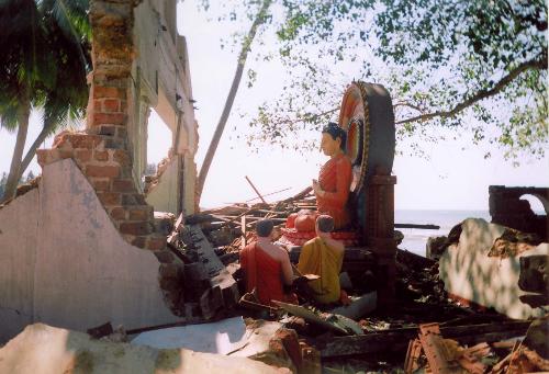 Magic or Physics? - Images from a Buddhist temple just after the worst tsunami in 2006. I am not superstitious but temple is devastated with all the concrete pillars leaving the 3 statues almost unharmed. (Slight damage to the knee of the buddha due to a huge concrete block flown with water.)