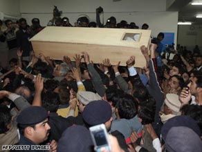 Bhutto's coffin - Supporters carry Bhutto's coffin out of Rawalpindi General Hospital.