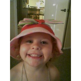 Halloween - Kiana in her shortcake hat. She insisted on being strawberry shortcake for Halloween. Go figure. That was hard to find but easy to make.