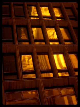 Church in the building - :) it's the reflection of the church on the windows of the buliding.I like these colors,you can see the clock too :) Yeah it's a simple picture with a little trick.