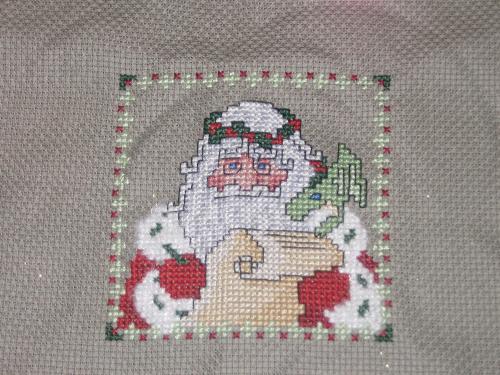 Santa Claus with Baby Dragon Cross Stitch Ornament - Cross Stitched ornament that I did for my sister-in-law for Christmas.
