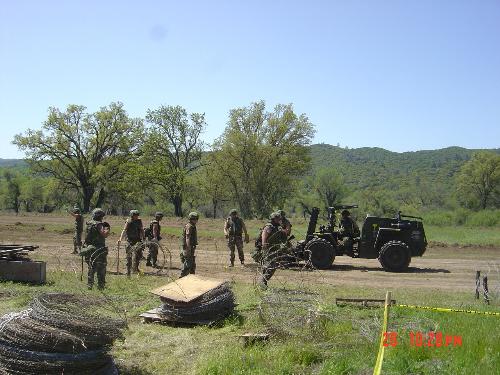 Team Work in the Field - Setting concertina wire