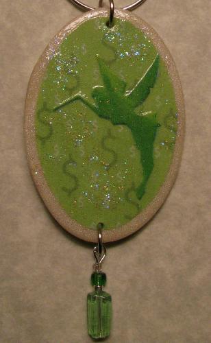Sales Fairy - This sales fairy is made with polymer clay, painted with a green acrylic and decoupaged with a fairy print. The sales fairy was a creation for a contest on Etsy.com and it's believed they have powers to help the sales in your store or online shop. This fairy was purchase by an Etsy member who proceeded to sell 3 items almost immediately after purchasing.  Hmmmm....