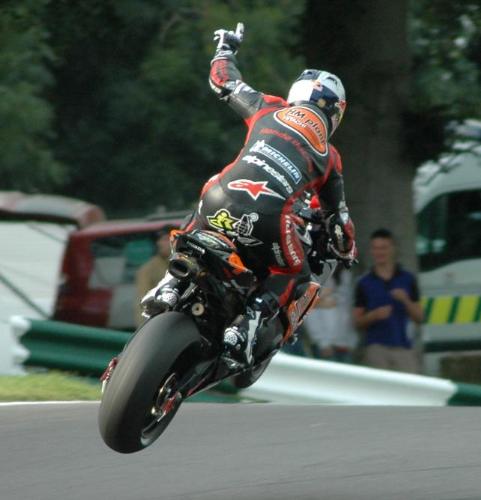 Johnny Rea, one handed over the mountain - Johnny Rea flying over the mountain at Cadwell Park, 2 wheels off the floor and one hand on the bars, you can see he was an ex moto-x rider.
