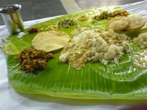 south indian meals - comprises of rice,porial,salt,pickels and others like appalam etc.