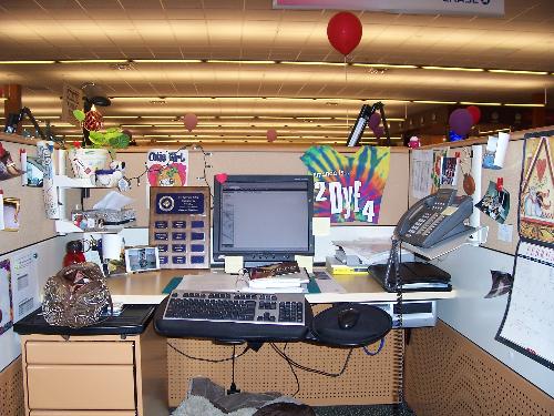 working in a cubicle - I always thought working in a cubicle would be awesome. It's not. I worked at a call centre in Ontario, Canada. It was horrible, the most violating and offensive job ever! You are tethered to the phone with your headset, you can't go anywhere! You can't even go have a pee without entering a code into your phone to use your 'personal time'. The company tracks all the minutes you have someone on hold, use personal time, tech time, etc etc. Anyhow, here is a picture of my cubicle, I tried to make it as fun as possible! HAHAHAHA