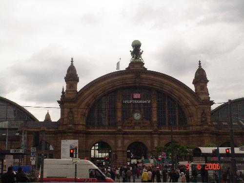 Frankfurt am Main - Hauptbahnhof/ Central Station - Frankfurt's main train station (Hauptbahnhof) was opened in 1888 after five hard years of construction work. It is still one of the largest train stations in Europe with 25 plateforms and over 1,500 trains departing every day. The monumental natural stone facade features an ornamental clock and is crowned by a sculpture od Atlas bearing the earth on his shoulders. The building is split up into three halls, all of which has been recently renovated. The station now boast dozens of shops, food outlets and a stylish waiting room.