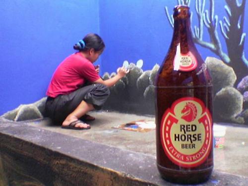 erning painting - working on a mural at Morong, Bataan