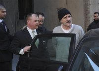 arrested - they got arrested because they brought a dead man to the bank