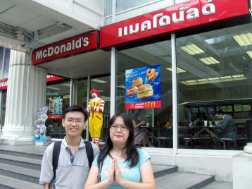 Be Successful - Deb doing the 'wai' in front of McD, Bangkok. Hui Sheng is the prop for this pix, I think.