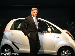 Tata Nano - Company chairman Ratan Tata poses next to the newly-launched Tata Nano.