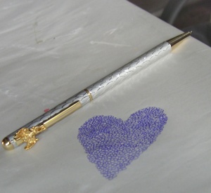 Love of writing - A hand drawn love heart with the pen resting near it.
The heart is created out of little tiny circles and is a doodle that my husband did the other day.
When finished he left the pen there and it seemed like a great photo