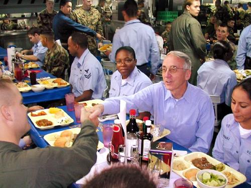 People - The Pacific Ocean, Oct. 24, 2002 — Secretary of the Navy Gordon England shares lunch with Sailors and Marines aboard the amphibious assault ship USS Tarawa (LHA 1) during a visit at sea off the coast of southern California. The Secretary told the men and women of Tarawa that President Bush and the American people are proud of them and appreciate the hard work they are doing in defense of freedom. U.S. Navy photo by USS Tarawa photo lab. Oct. 24, 2002