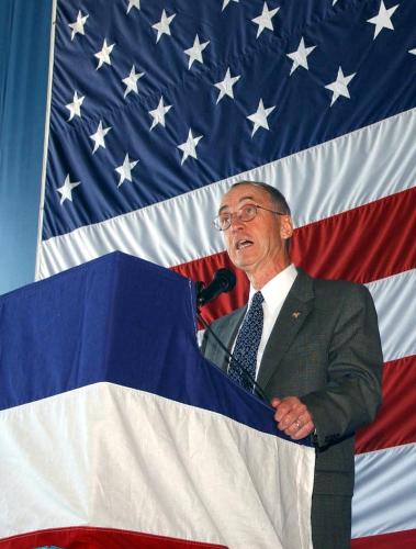 People - Naval Air Station, Oceana, Va. Oct. 3, 2002 — The Honorable Gordon R. England, Secretary of the Navy, speaks at a Change of Command Ceremony for Commander, Carrier Air Wing Eight (CVW-8) held aboard Naval Air Station, Oceana. Capt. David A. Newland is relieving Capt. David J. Mercer who has been in command of the airwing since June of 2001. U.S. Navy photo by Photographer’s Mate 3rd Class Stacey Hines. [021003-N-3692H-502] Oct. 3, 2002