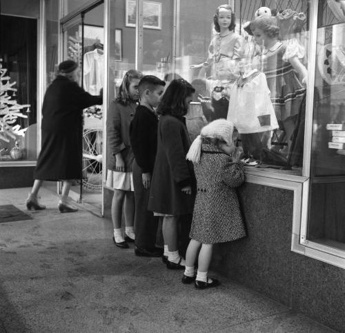 Four youngsters window shopping back in the 50's o - four youngsters window shopping back in the 50's or 60's