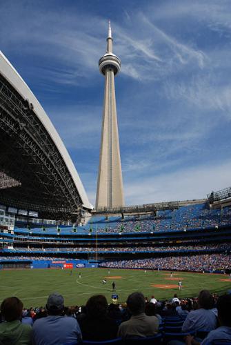 The CN Tower in Toronto - I didn't actually take this photo, but I have a very similar one from my vacation to Toronto years ago. My husband is a huge fan of baseball, and when we found out his Texas Rangers would be in Toronto while we were there, I went ahead and let him get tickets. With the conversion rate, which was very favorable at the time, we got great seats. In fact, we were sitting somewhere just ahead of the spot from which this was taken. Overall, it was quite a fun trip. Even if I did have to sit through an entire baseball game! :-p