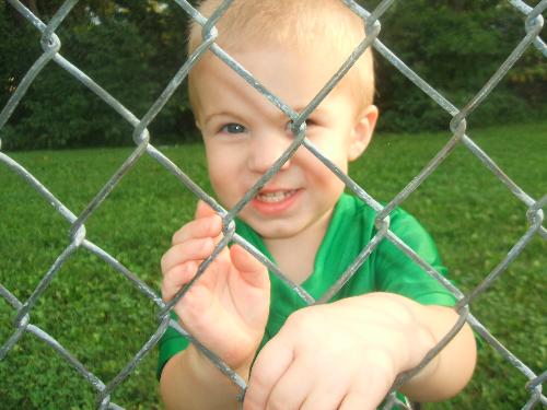 little stud - logan playing at the soccer field