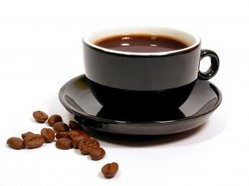 Coffee  - Coffee in a coffee cup with coffee beans