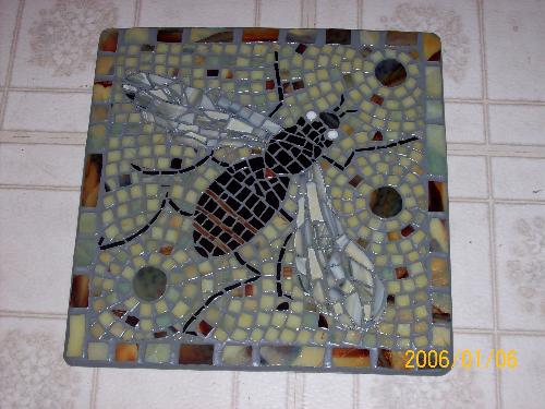 Fly On The Wall Mosaic - My first mosaic project. Each peice of glass was hand nipped as I had no glass cutter yet, only nippers. The piece is 10in x 10in and can be hung on wall or put on included plaque stand. Background wall can be done in tri-colored blues, reds, or greens. Grout done in black or grey.