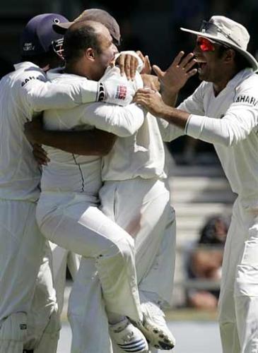 shewag - shewag celebrates after taking the wicket of gilchirist