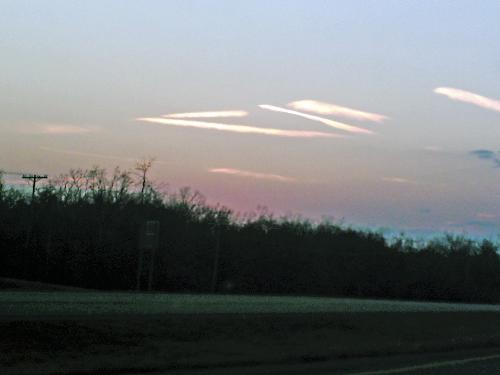Triangle clouds - I took this picture late one afternoon. I've seen lines of clouds before, but none that formed a triangle in the sky.