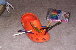 Pencils and Pens in a Shoe - My son stuck pens, pencils and markers in a friend&#039;s shoe.