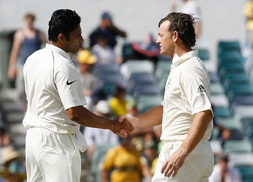 Kumble and Gilly - Wonderful sportsman that he is, Adam Gilchrist congratulates Kumble after he had taken his 600th wicket.