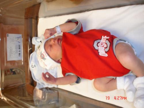 baby OSU fan  - Here's our brand-new little guy, already making the 'Big O' sign; we start young here in Ohio Buckeye territory!