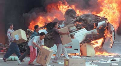 Jakarta Riot 2 - Angry Indonesian mobs burn cars and Chinese-owned shops as they plundered Jakarta in anti-Chinese riots, May 1998.
