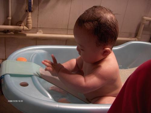 bath photo - a baby has a bath