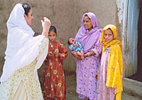 Family - Falaknaz explains the importance of immunization to a Pakistani family.