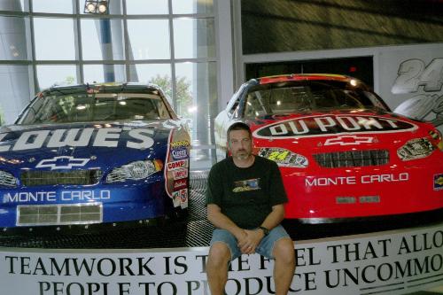 Me in front of #48 and #24 - In 2006 I vacationed in North Carolina. Of course, I had to go to Hendricks Motorsports Complex