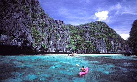 Palawan beach - Limestone mountain along the beach in Northern Palawan--El Nido.

Photo taken from http://www.guardian.co.uk/travel/2007/feb/16/beach.top10?page=all